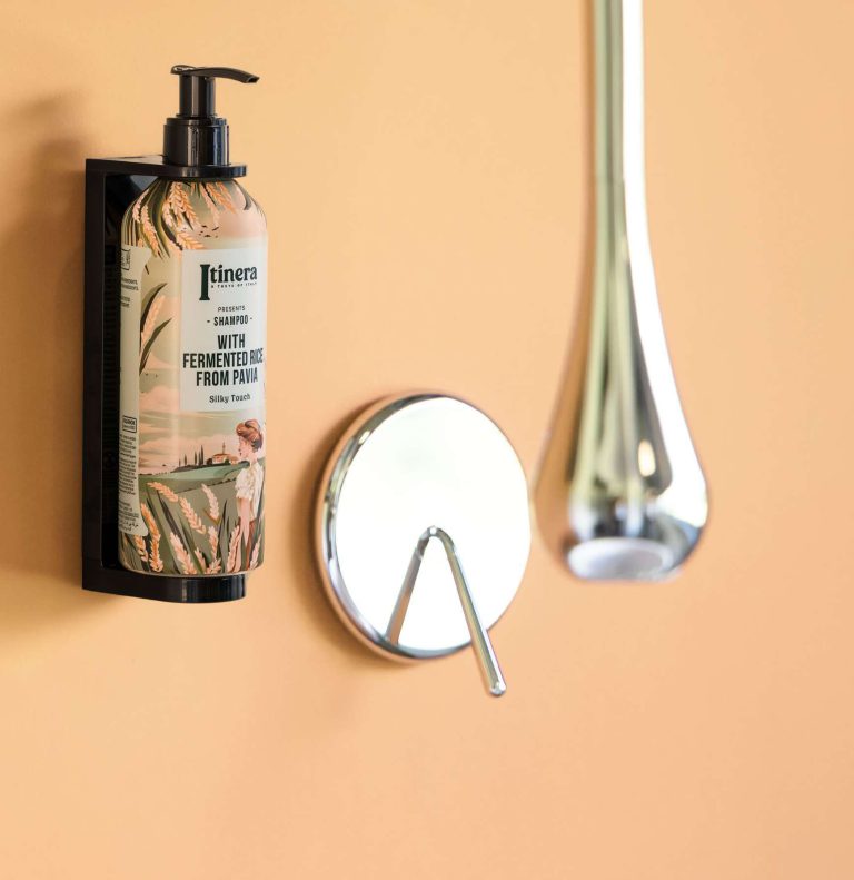 Itinera Silky Touch Conditioner dispenser on a wall bracket