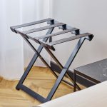 Compact black Luggage rack with brown straps
