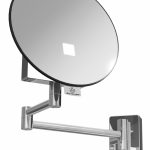 Eclips illuminated magnifying wall mirror